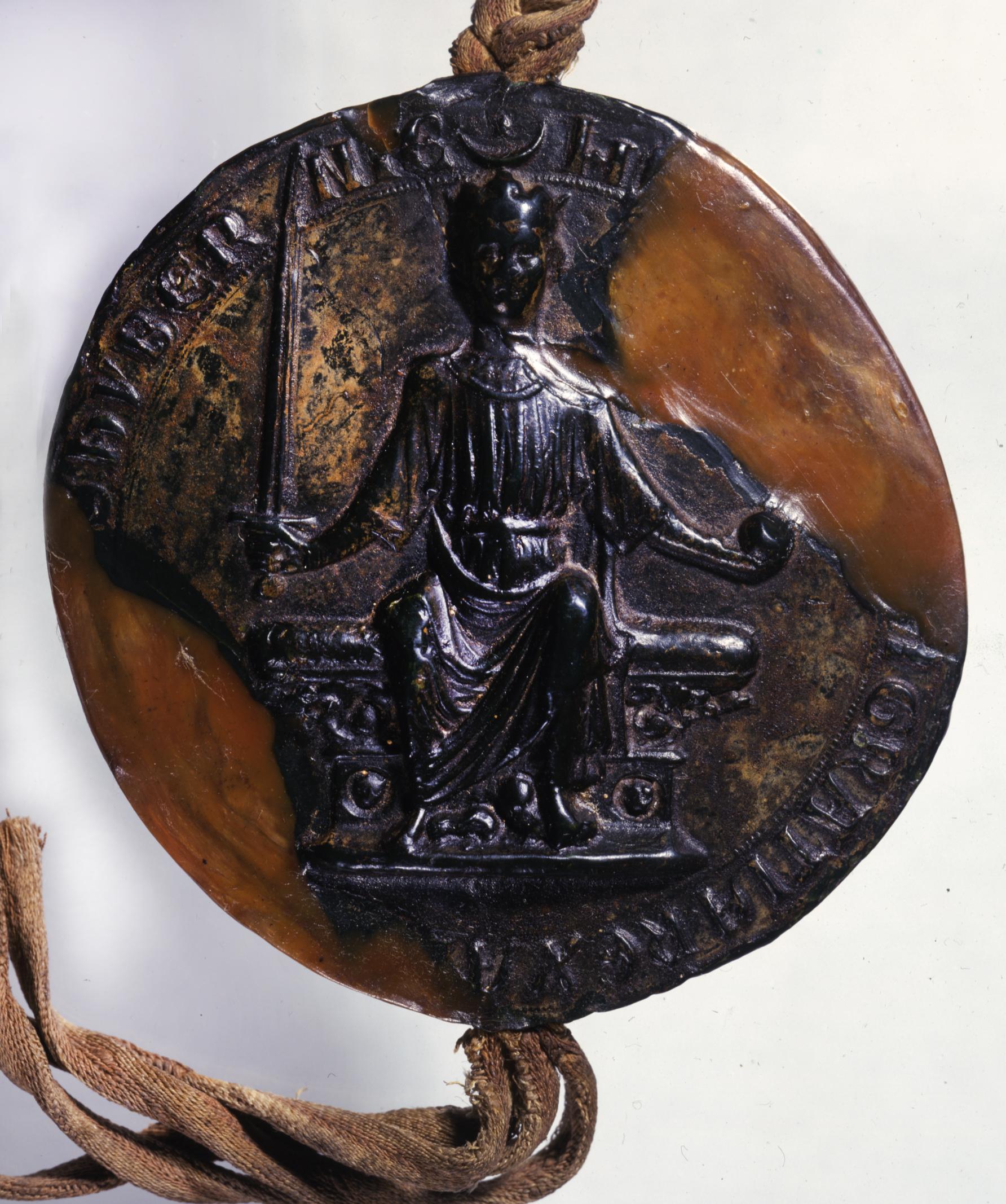 Obverse of the wax seal of King Henry III of England showing the king seated in majesty on a throne without a back.