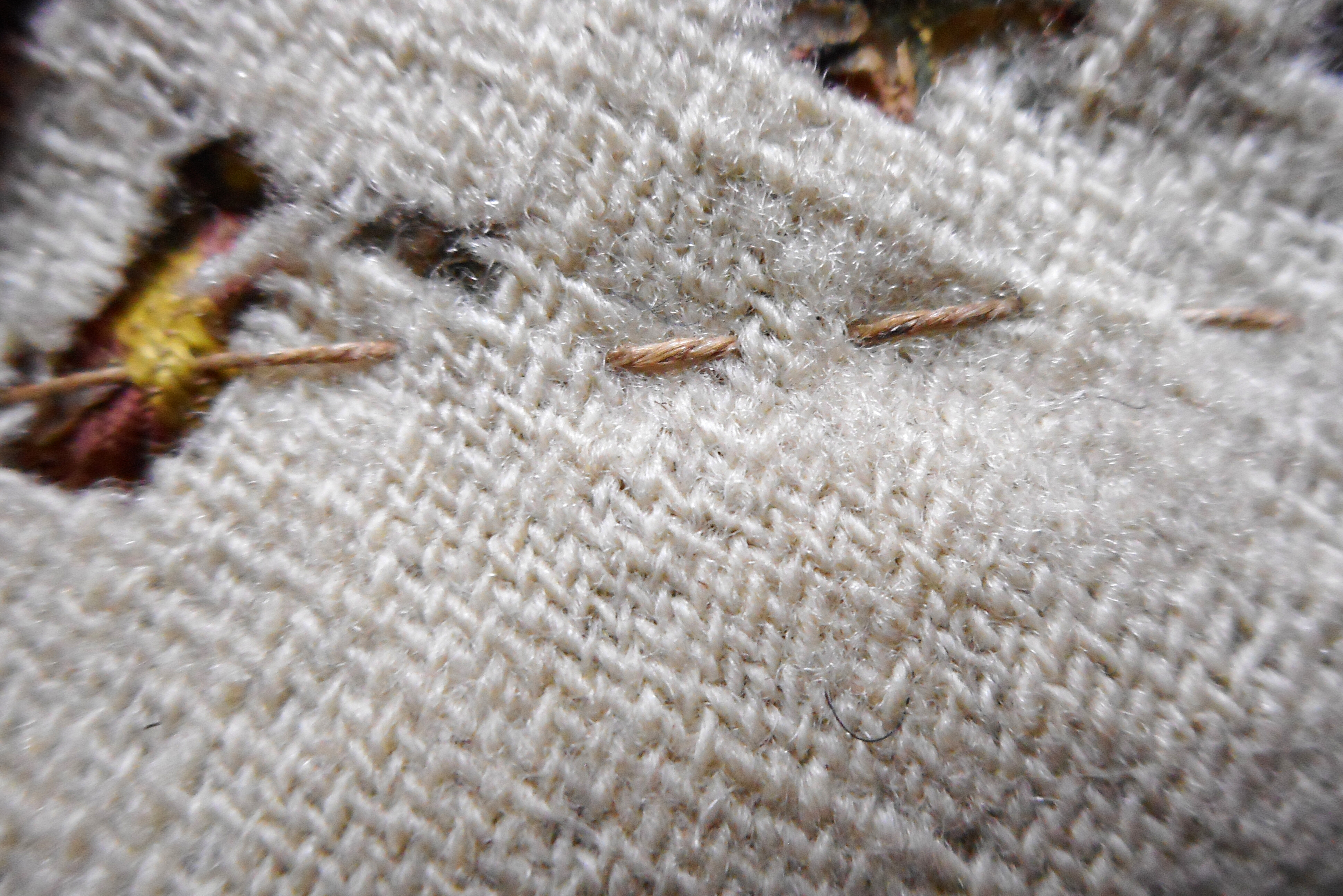 Close-up detail of the inside of the bag where an undyed thread was sewn straight across the fabric.